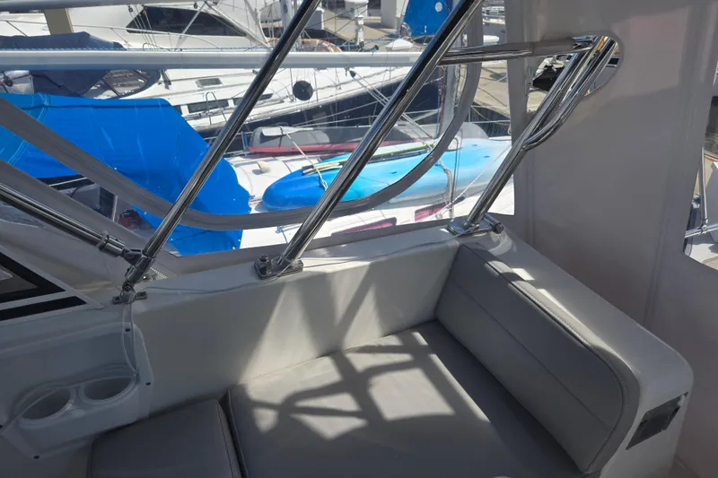 Slide: The Image of Interior view of 2012 American Tug 365 Flybridge with seating and chrome railings. - 79