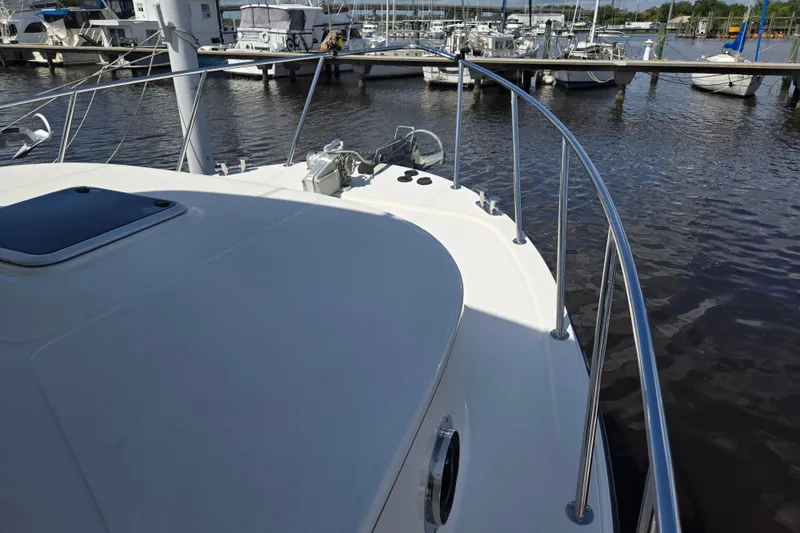 Slide: The Image of Bow view of 2012 American Tug 365 Flybridge at marina dock. - 85