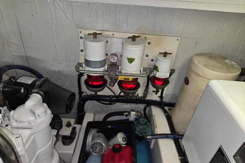 Slide: The Image of Engine room of 2012 American Tug 365 Flybridge with fuel filters and machinery. - 97