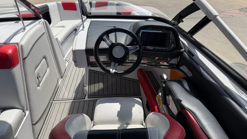 Slide: The Image of Interior of a 2014 Nautique G25 boat with modern cockpit. - 11