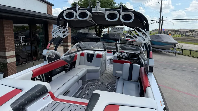 Slide: The Image of 2014 Nautique G25 boat with sleek design and sound system. - 14