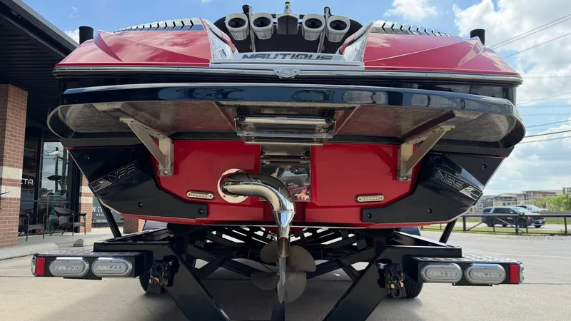 Slide: The Image of Rear view of a 2014 Nautique G25 boat on a trailer. - 5