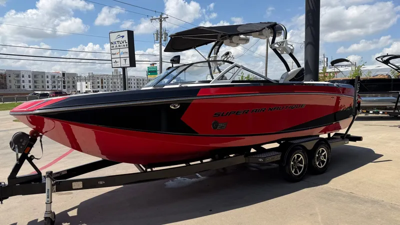 Slide: The Image of Red 2014 Nautique G25 boat on trailer at NXT LVL Marine. - 8