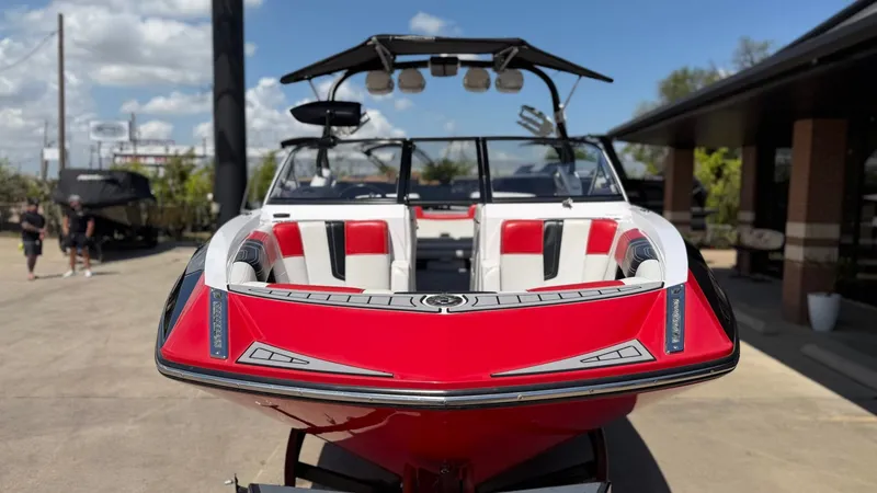 Slide: The Image of Red 2014 Nautique G25 boat on trailer, front view. - 9