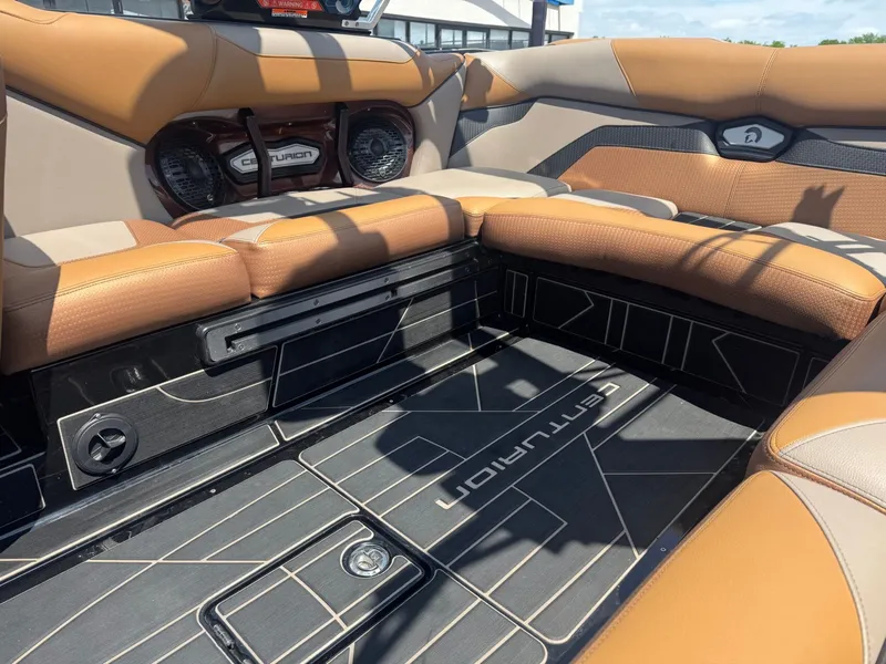 Slide: The Image of Interior of Centurion Ri230 boat, 2023 model, featuring brown leather seats. - 12