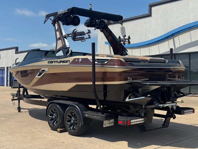 Slide: The Image of 2023 Centurion Ri230 boat on trailer, side view. - 3