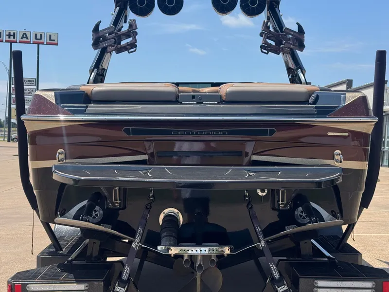 Slide: The Image of Rear view of a 2023 Centurion Ri230 boat on a trailer. - 4