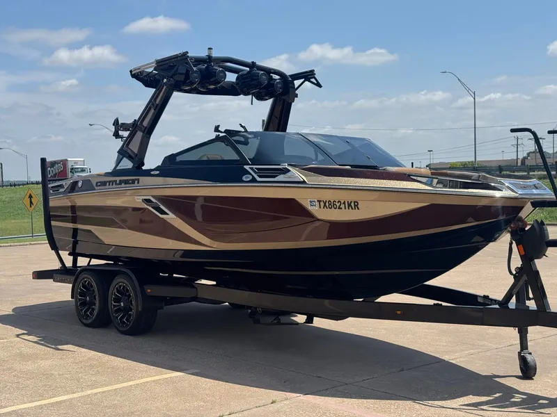 Slide: The Image of 2023 Centurion Ri230 boat on trailer in sunny weather. - 6