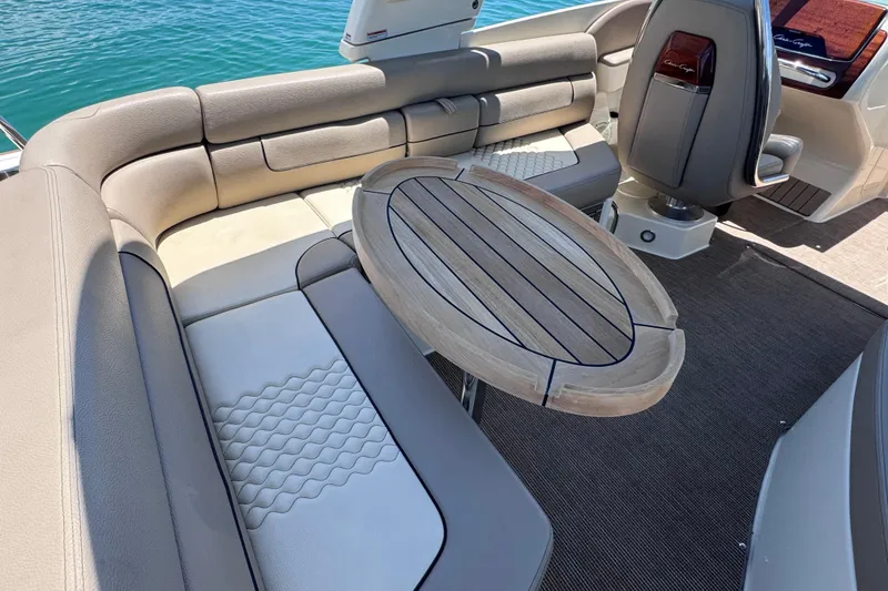 Slide: The Image of Luxurious interior of 2023 Chris-Craft Launch 25 GT boat with elegant seating and wooden table. - 19