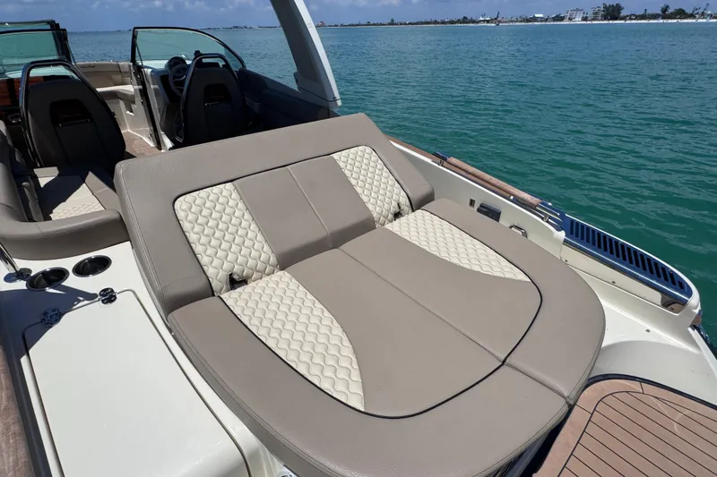 Slide: The Image of 2023 Chris-Craft Launch 25 GT boat with luxurious seating on a sunny day. - 23