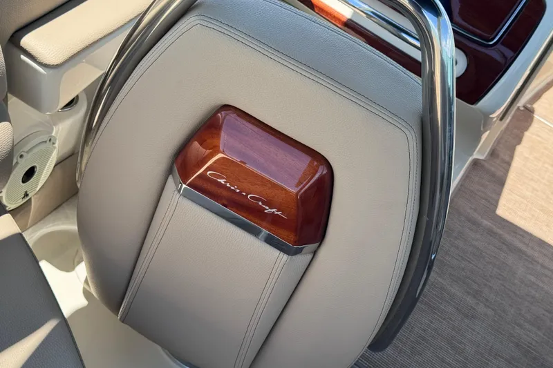 Slide: The Image of 2023 Chris-Craft Launch 25 GT steering wheel with elegant wood and leather detailing. - 31