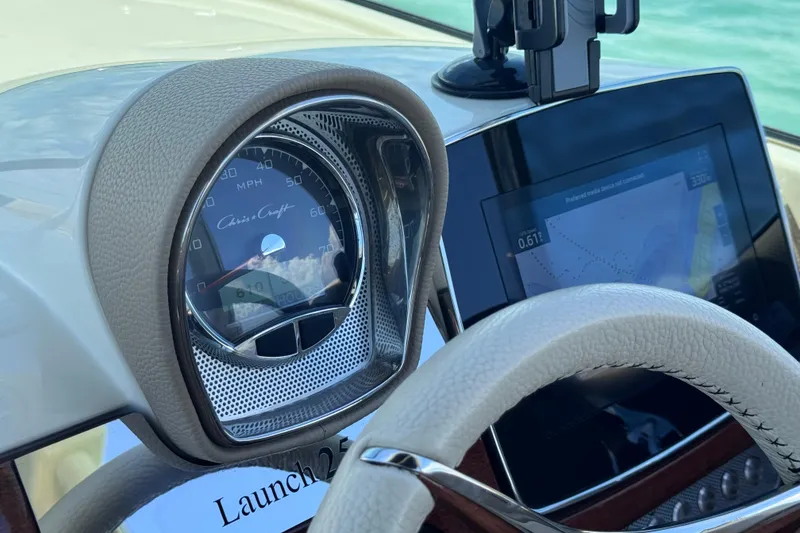Slide: The Image of Dashboard of 2023 Chris-Craft Launch 25 GT with speedometer and navigation display. - 33