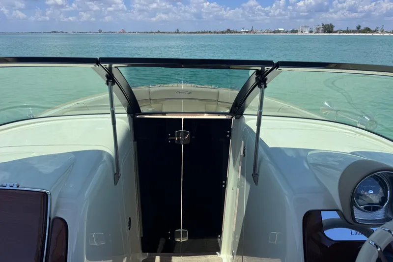 Slide: The Image of 2023 Chris-Craft Launch 25 GT boat interior with open water view. - 37
