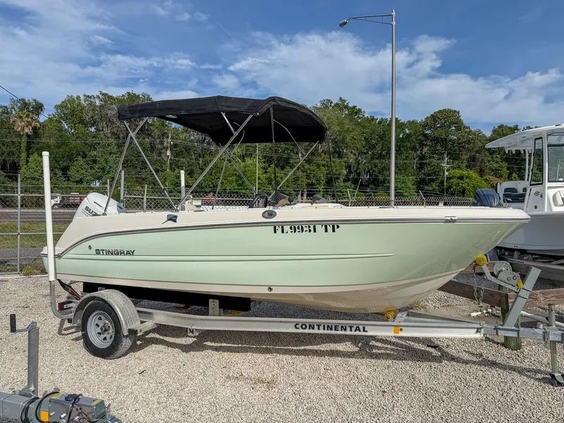 The Image of 2023 Stingray 172 SC boat on trailer, parked outdoors. - 1