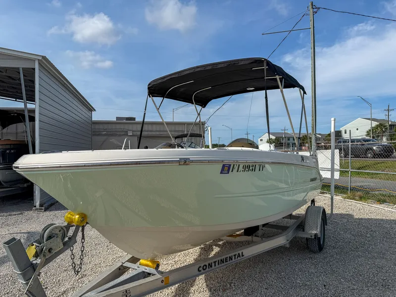 Slide: The Image of 2023 Stingray 172 SC boat on trailer outdoors. - 3