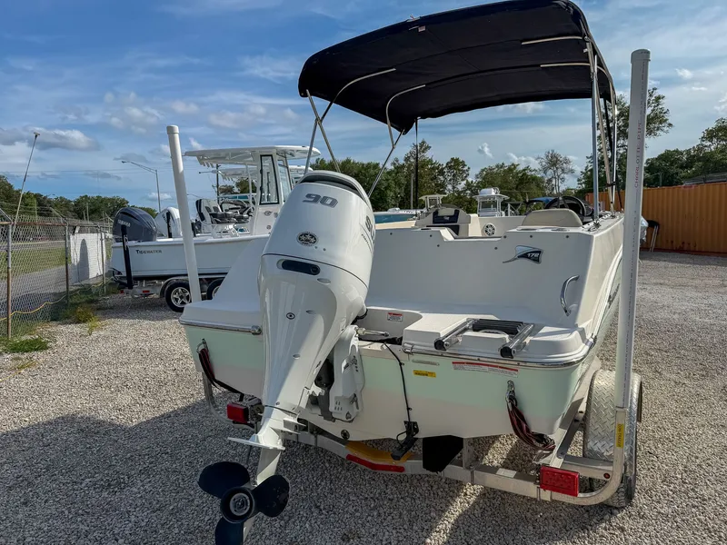 Slide: The Image of 2023 Stingray 172 SC boat with outboard motor on trailer. - 5