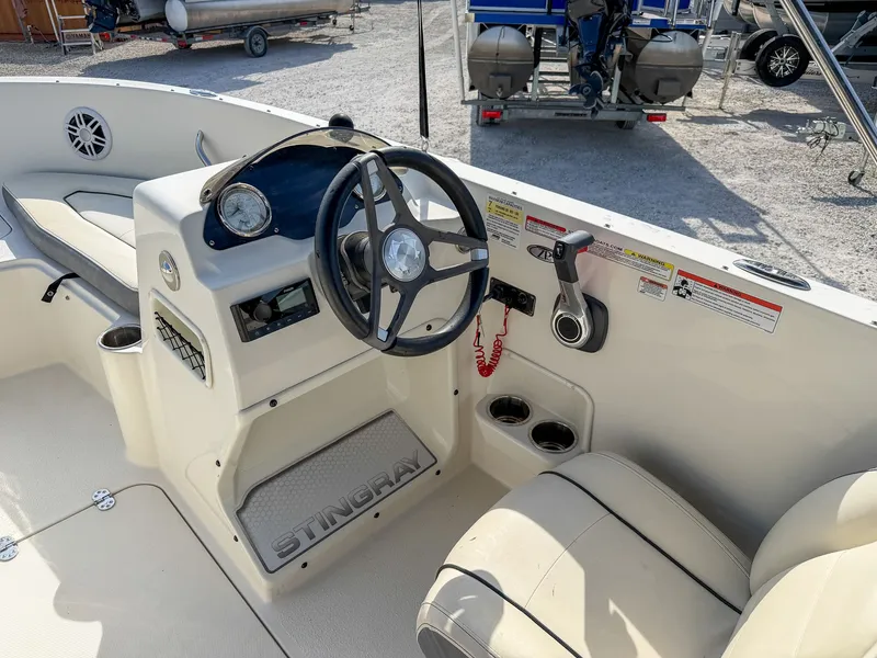 Slide: The Image of Interior view of 2023 Stingray 172 SC boat cockpit. - 8