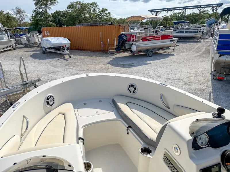 Slide: The Image of 2023 Stingray 172 SC boat outdoors in a parking area. - 9