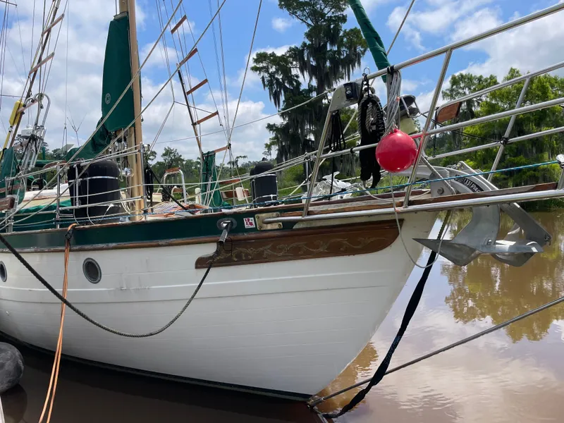 The Image of 1983 Formosa Spindrift 43 sailboat docked by the riverbank. - 0