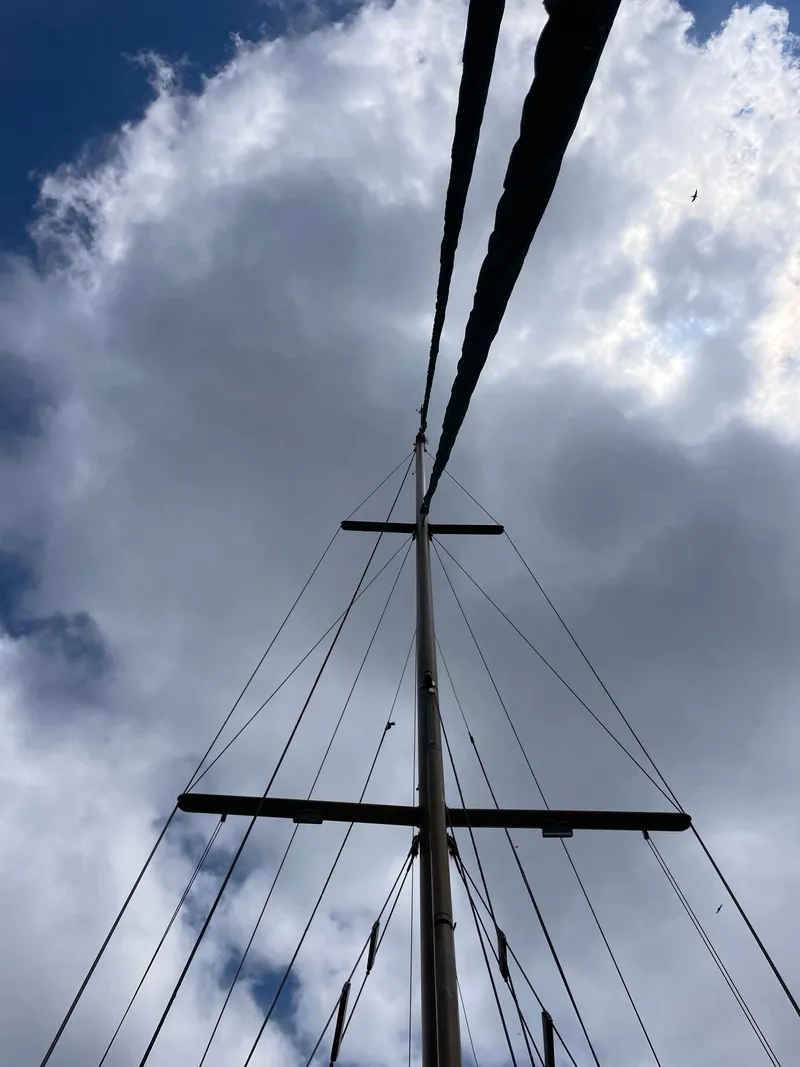 Slide: The Image of Mast of 1983 Formosa Spindrift 43 against cloudy sky. - 11