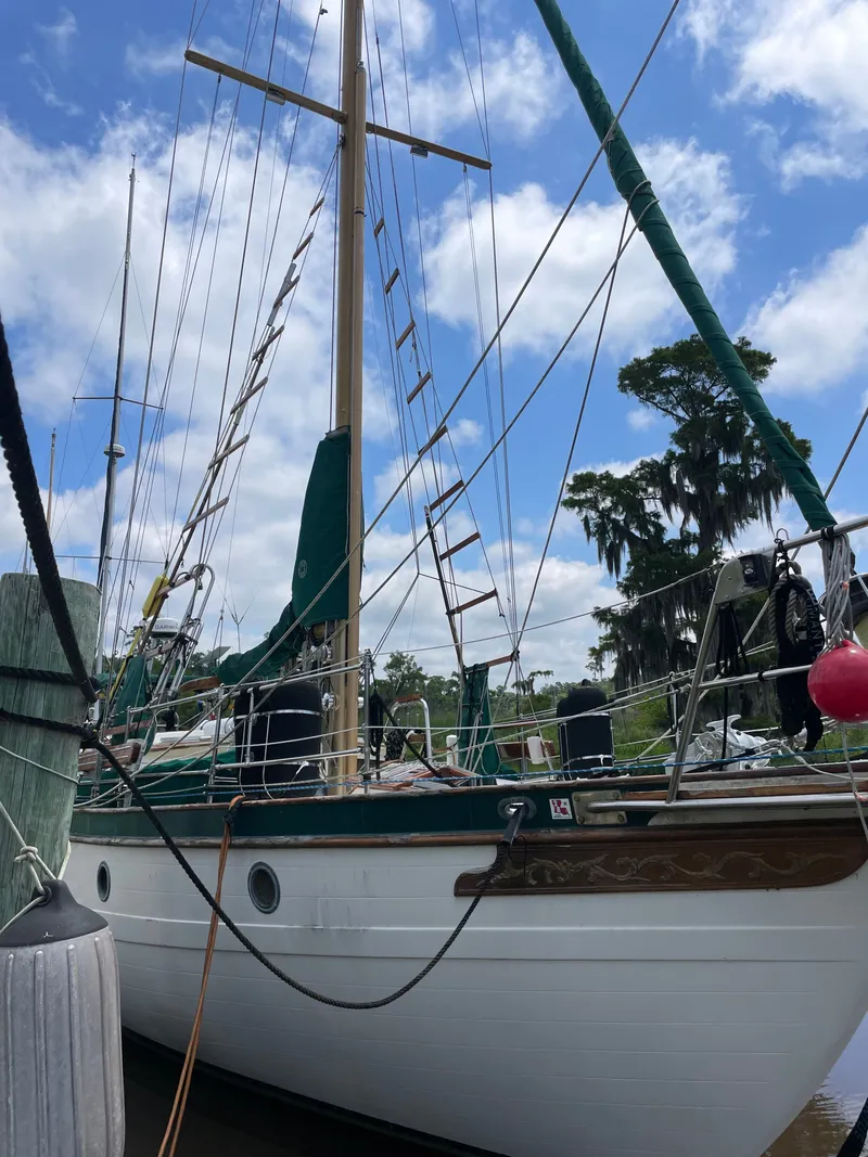 Slide: The Image of 1983 Formosa Spindrift 43 sailboat docked at harbor. - 2