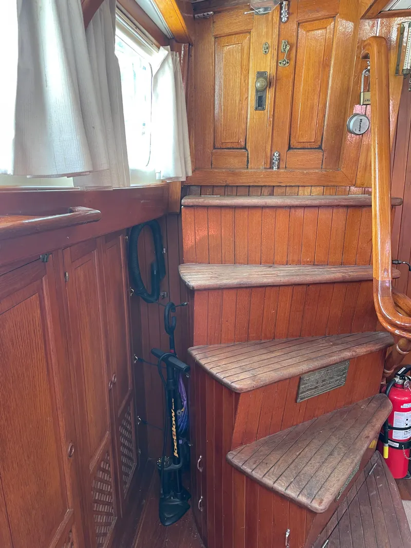 Slide: The Image of Wooden staircase inside the 1983 Formosa Spindrift 43 yacht. - 20