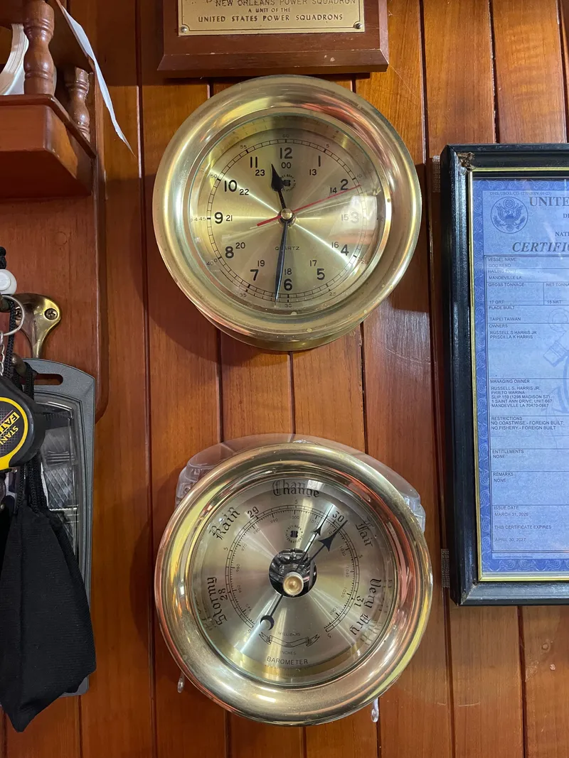 Slide: The Image of Brass clock and barometer on wood paneling in 1983 Formosa Spindrift 43. - 32