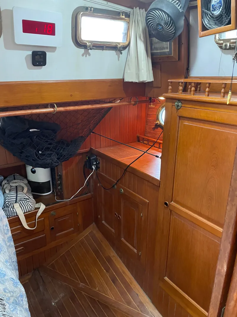 Slide: The Image of Interior of a 1983 Formosa Spindrift 43 yacht with wooden furnishings. - 36