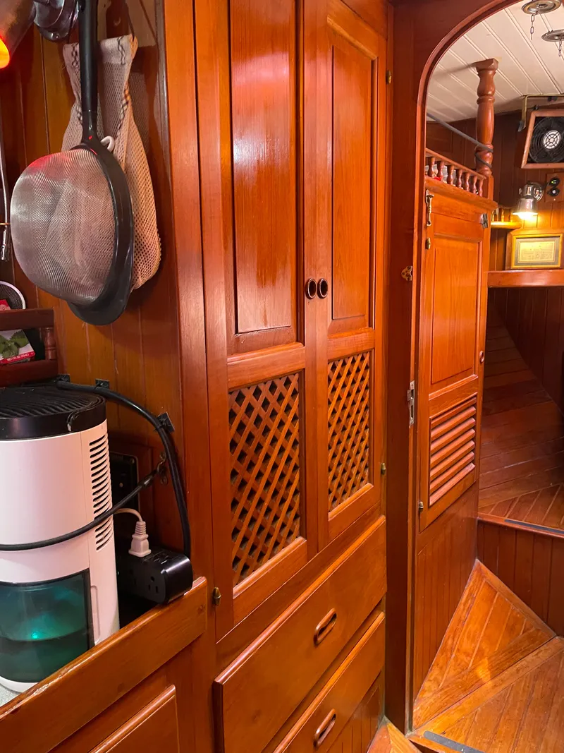 Slide: The Image of Interior of a 1983 Formosa Spindrift 43 yacht with wooden cabinetry. - 47