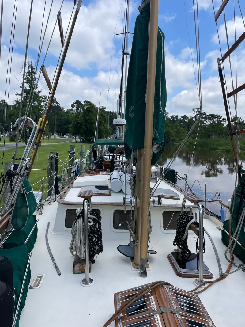 Slide: The Image of 1983 Formosa Spindrift 43 sailboat docked by the river. - 5