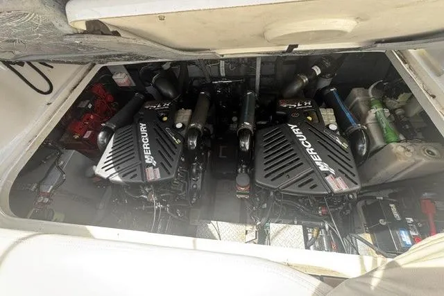 Slide: The Image of Engine compartment of a 2002 Sea Ray 360 Sundancer with twin Mercury engines. - 1