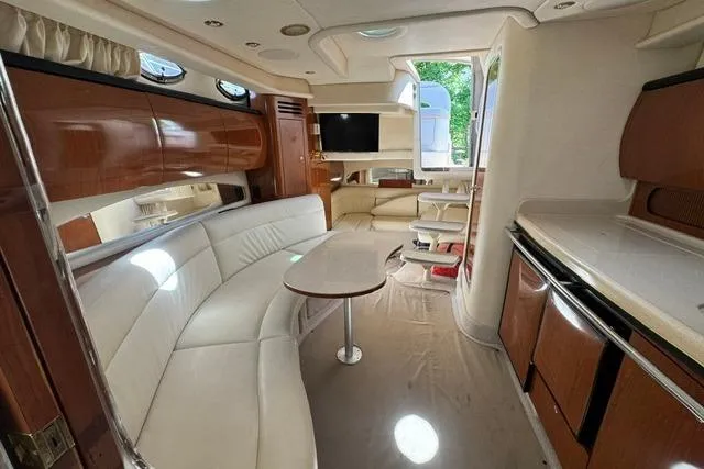 Slide: The Image of Luxurious interior of a 2002 Sea Ray 360 Sundancer yacht with elegant seating and modern amenities. - 15