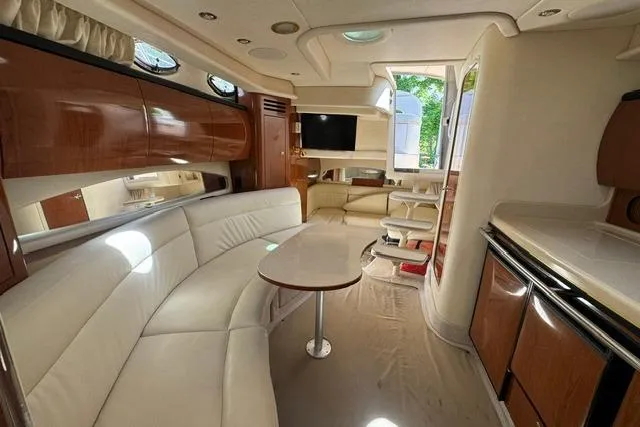 Slide: The Image of Luxurious interior of a 2002 Sea Ray 360 Sundancer yacht with elegant seating and modern amenities. - 16