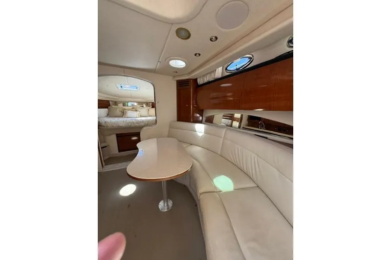 Slide: The Image of Interior of 2002 Sea Ray 360 Sundancer yacht with plush seating and elegant design. - 17