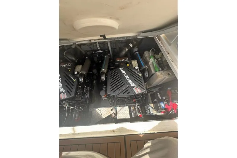 Slide: The Image of Engine compartment of 2002 Sea Ray 360 Sundancer with Mercury engines visible. - 2