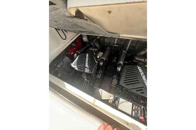 Slide: The Image of Engine compartment of a 2002 Sea Ray 360 Sundancer with Mercury engines visible. - 3