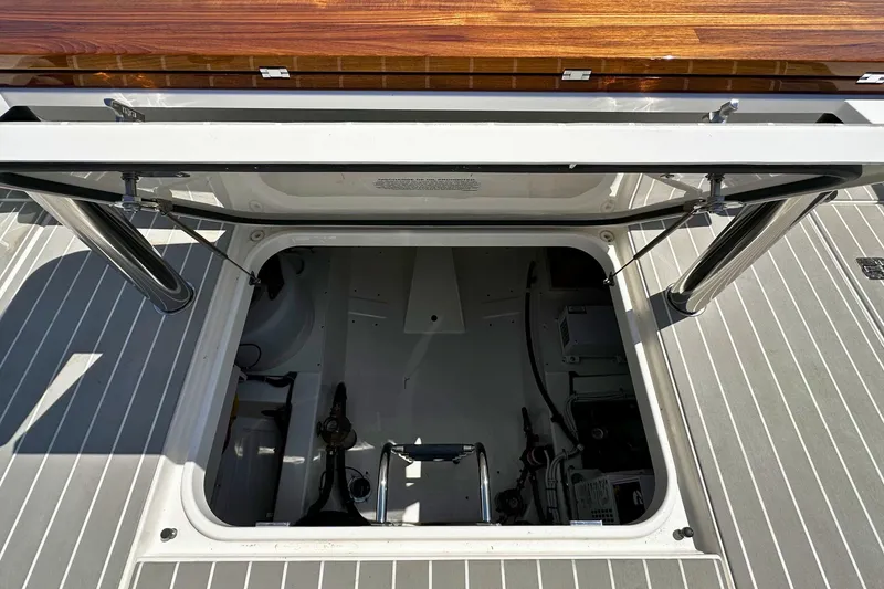 Slide: The Image of Open hatch on 2027 Tiara Yachts 56 LS, revealing interior storage compartment. - 14