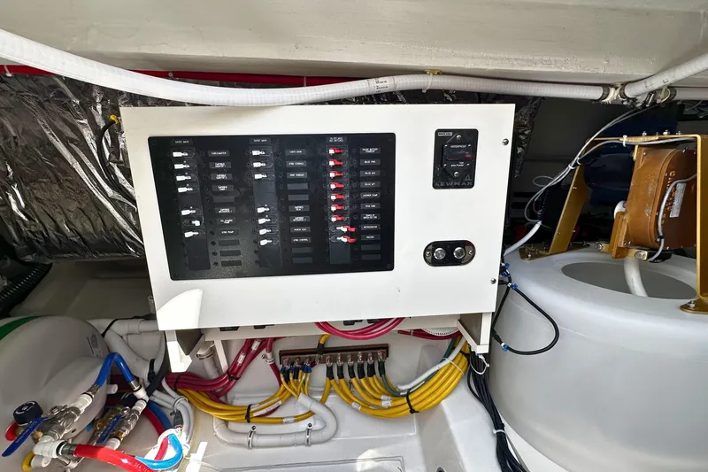 Slide: The Image of Electrical panel and wiring in 2027 Tiara Yachts 56 LS engine room. - 15
