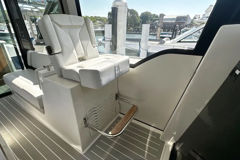 Slide: The Image of Luxury seating on 2027 Tiara Yachts 56 LS, featuring sleek design and premium materials. - 31