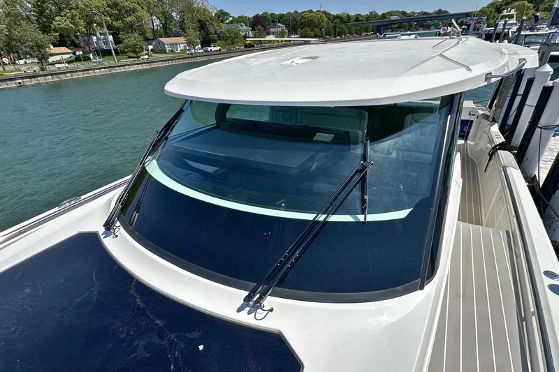 Slide: The Image of 2027 Tiara Yachts 56 LS docked, showcasing sleek design and modern features. - 39