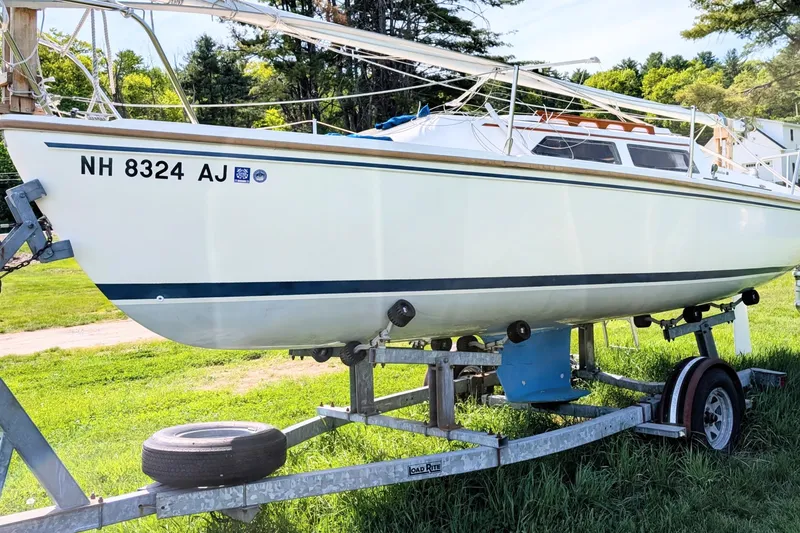 The Image of 1989 Catalina 22 sailboat on trailer, parked on grass, with registration number NH 8324 AJ. - 0