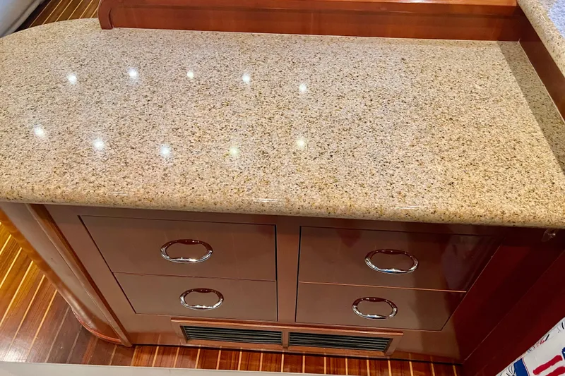 Slide: The Image of Granite countertop with wooden drawers in 2005 Carver 56 Voyager yacht interior. - 13
