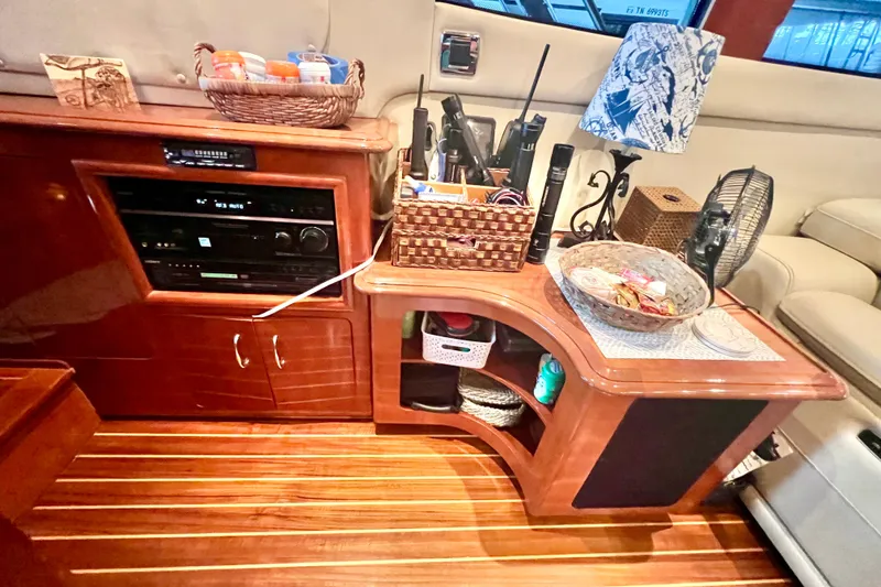 Slide: The Image of Interior of 2005 Carver 56 Voyager yacht with wooden cabinetry and organized storage. - 15