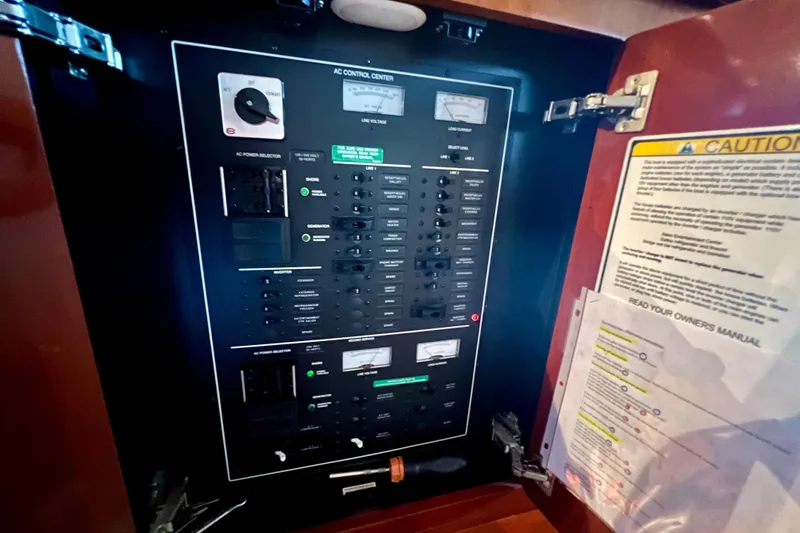 Slide: The Image of Electrical control panel inside a 2005 Carver 56 Voyager yacht. - 17