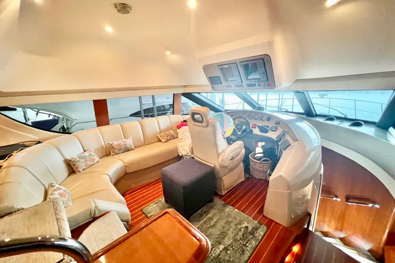 Slide: The Image of Luxurious interior of a 2005 Carver 56 Voyager yacht with plush seating and modern helm. - 19