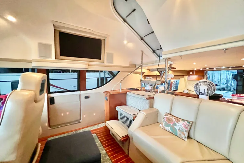 Slide: The Image of Luxurious interior of a 2005 Carver 56 Voyager yacht with elegant seating and modern amenities. - 20