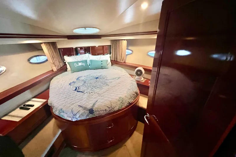 Slide: The Image of Luxurious bedroom interior of 2005 Carver 56 Voyager yacht with elegant bedding. - 23