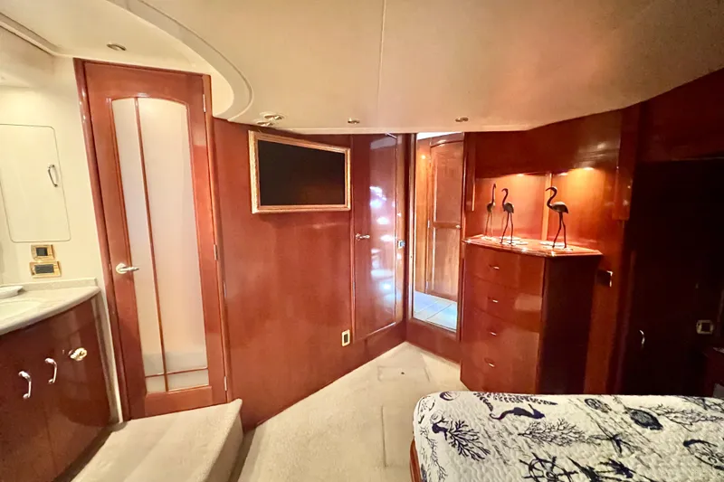 Slide: The Image of Luxurious interior of 2005 Carver 56 Voyager yacht with elegant wood finishes and decor. - 27