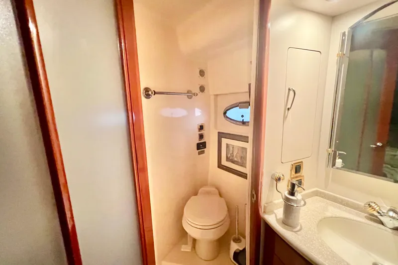 Slide: The Image of Bathroom interior of 2005 Carver 56 Voyager yacht, featuring toilet and sink. - 29