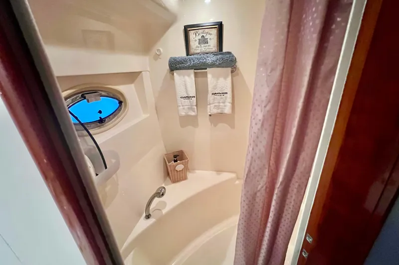 Slide: The Image of Bathroom interior of 2005 Carver 56 Voyager yacht with shower and porthole window. - 30